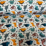 Krāsaini dinozauri uz balta pamata, flanelis.